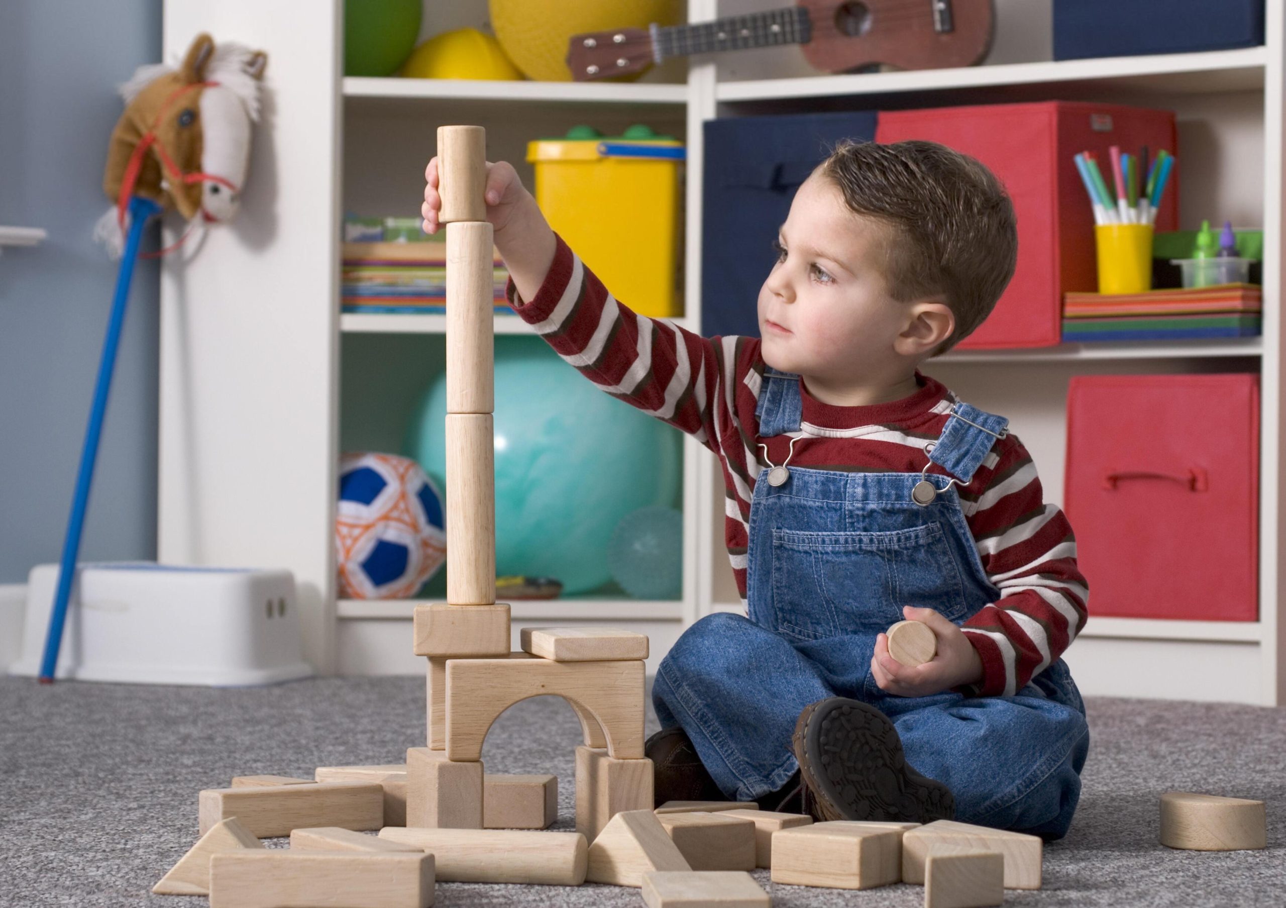 A child playing with wooden blocks